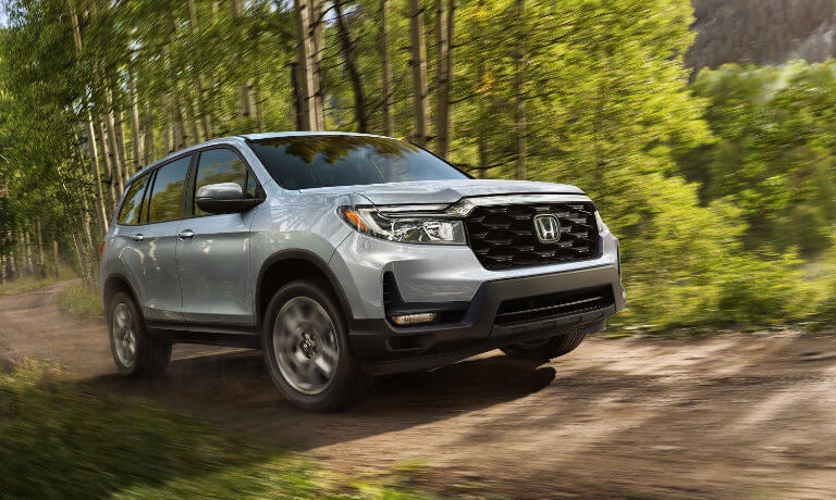 2022 Honda Passport driving in the forest